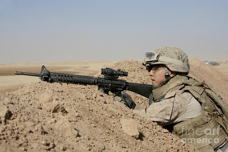 A Soldier Positions Himself On Top Photograph by Stocktrek Images