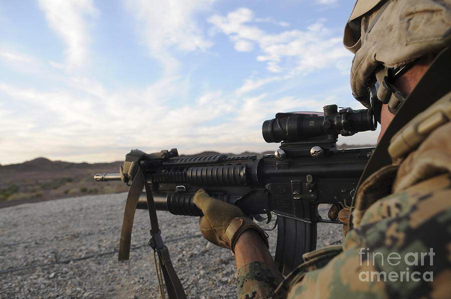 A Soldier Sights In To Fire On A Target Photograph by Stocktrek Images