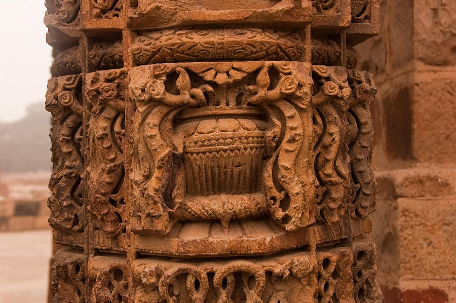 A stone pillar with beautiful carvings inside the Qutub Minar complex Photograph by Ashish Agarwal
