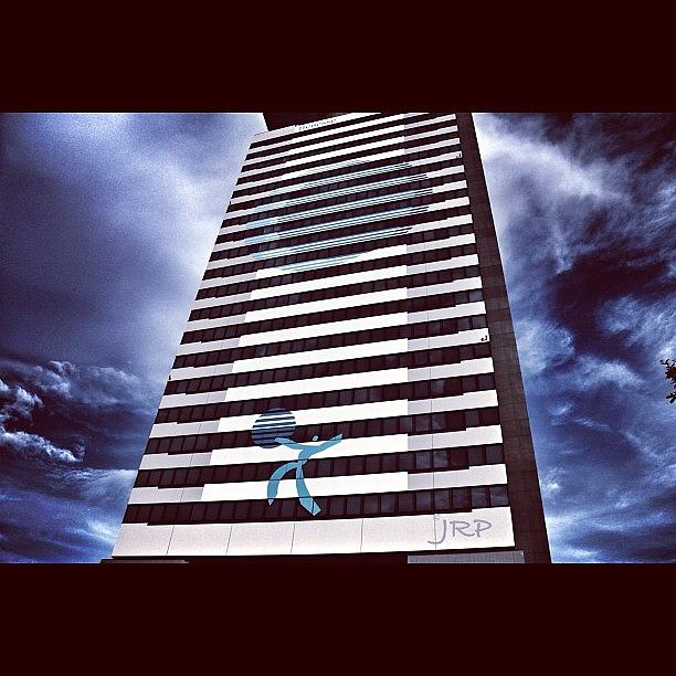 Nature Photograph - A Tall Building Against A Dramatic Sky by Julianna Rivera-Perruccio