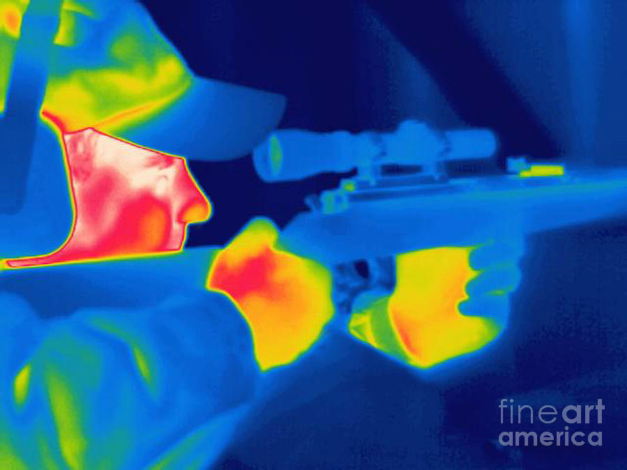 Sports Photograph - A Thermogram Of A Man Holding A Rifle by Ted Kinsman