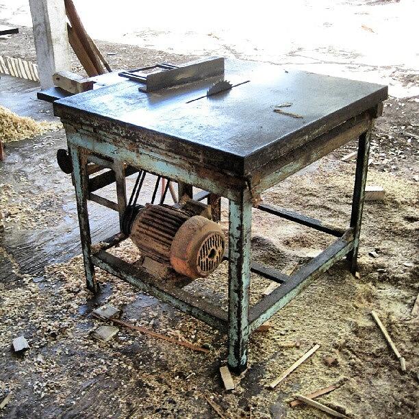 Tool Photograph - A Trusty And Well Worn Table Saw In A by Reid Nelson
