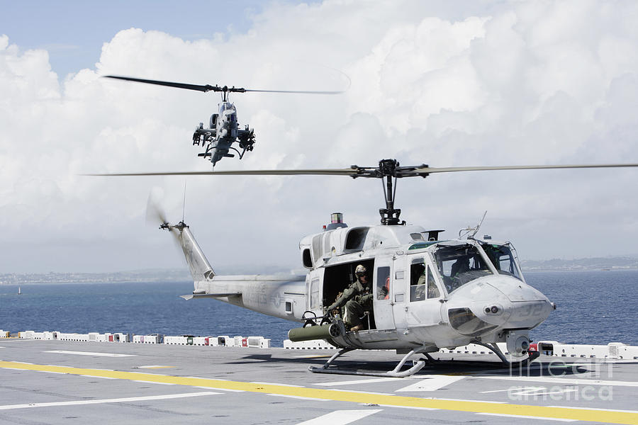 A Uh-1n Huey And An Ah-1w Super Cobra Photograph by Stocktrek Images