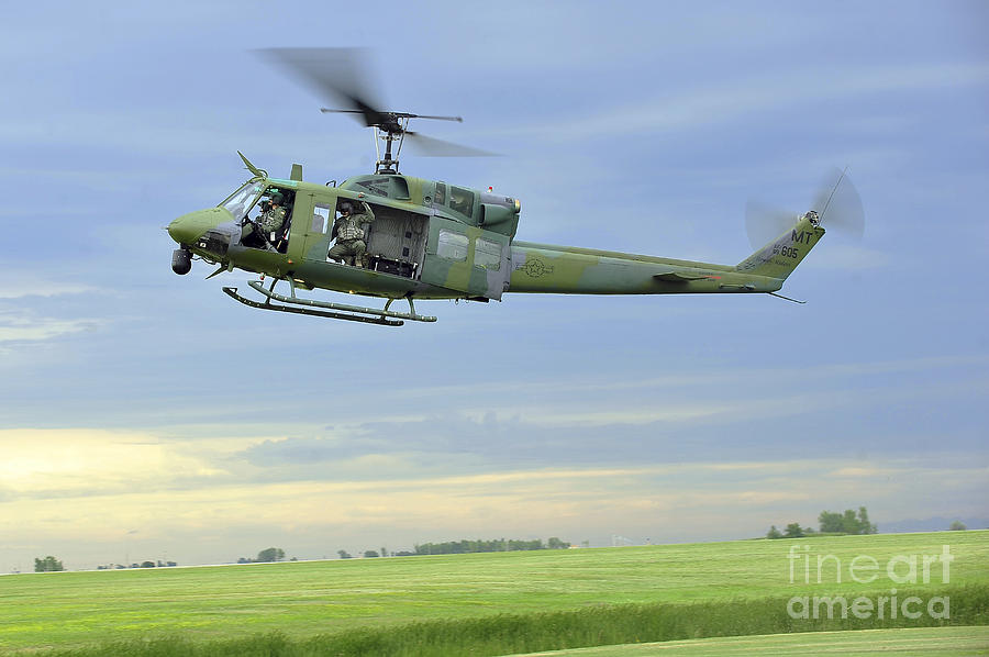 A Uh-1n Huey Helicopter Prepares Photograph by Stocktrek Images