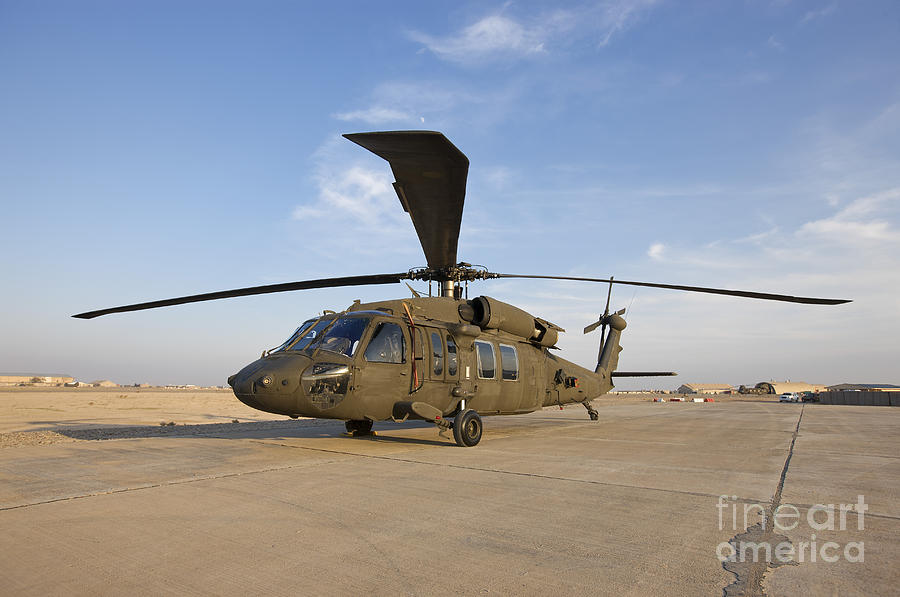 A Uh-60 Black Hawk Helicopter At Camp Photograph by Terry Moore