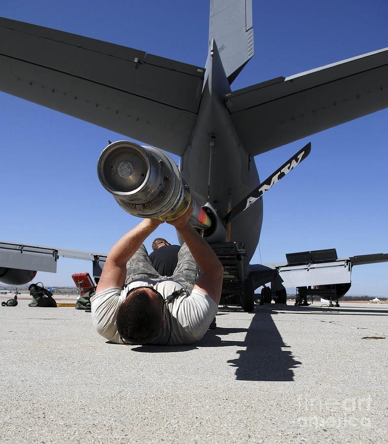 A U.s. Air Force Airman Lifts The Boom Photograph by Stocktrek Images