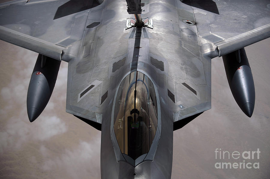 Airplane Photograph - A U.s. Air Force F-22 Raptor by Stocktrek Images