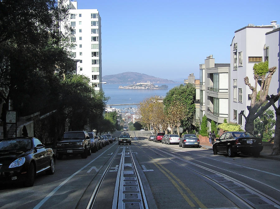 A view of the sloping streets and the far off Alcatraz in San Francisco Photograph by Ashish Agarwal