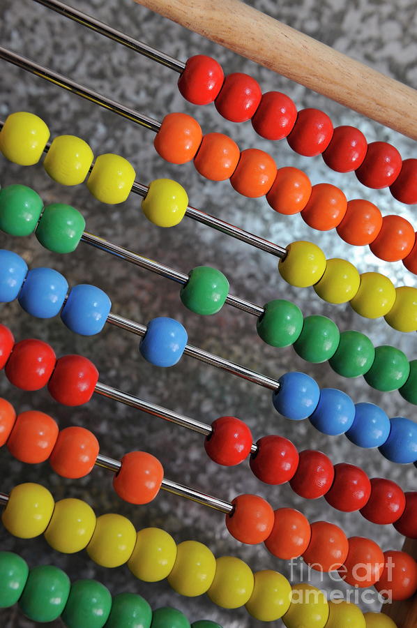 Abacus with multicoloured beads Photograph by Sami Sarkis