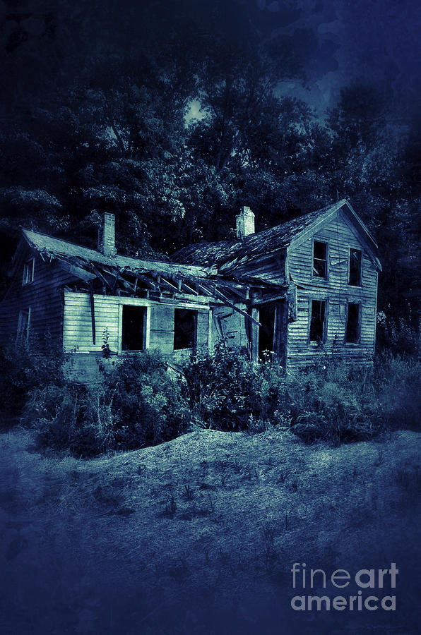 abandoned house in woods at night