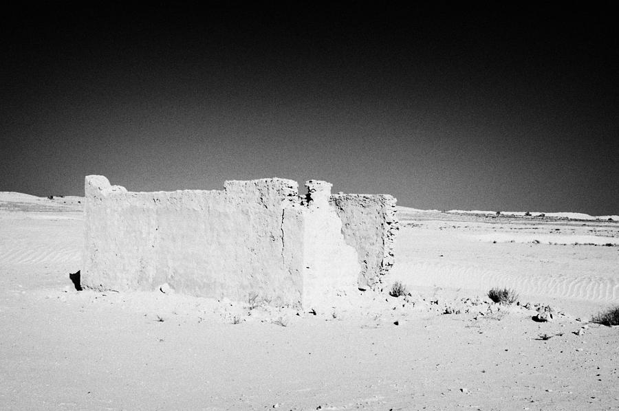 Desert Photograph - abandoned ruined building in the sahara desert at Douz Tunisia by Joe Fox