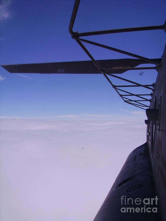 Helicopter Photograph - Above the clouds by Christopher Griffin
