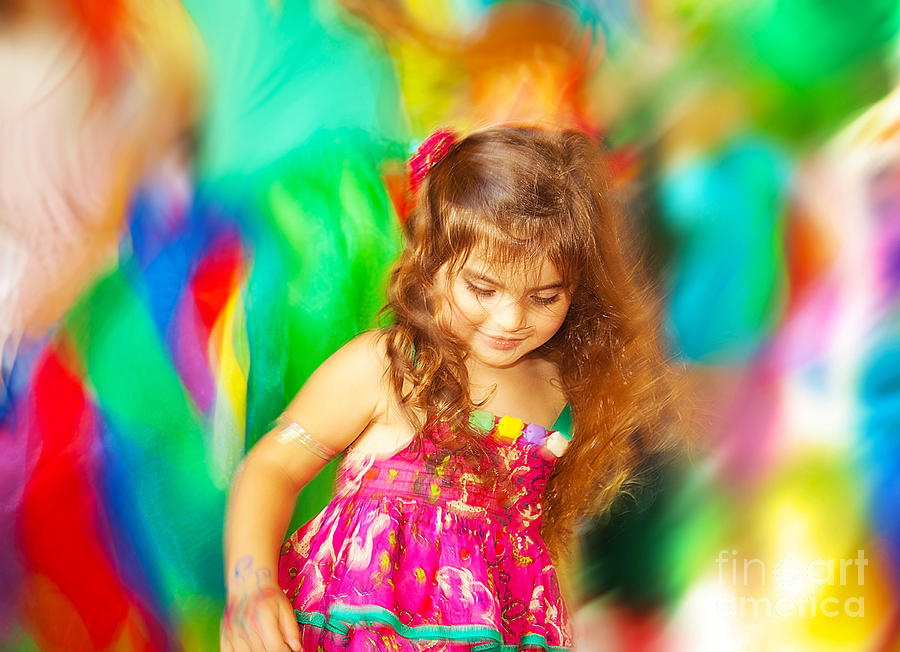 Adorable small girl dancing over blur colors background Photograph by Anna Om
