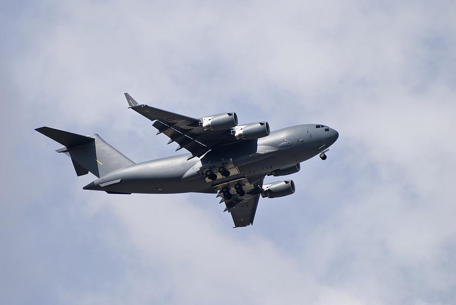 Airplane In The Sky Photograph by Philippe Widling - Fine Art America