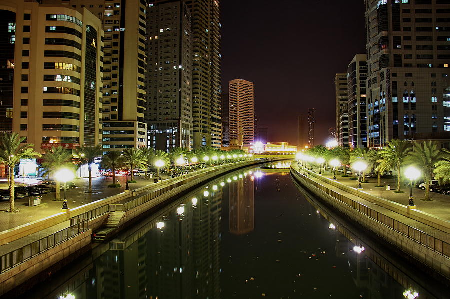 Al Qasba Canal After The Celebration Photograph by Hussein Kefel - Fine ...