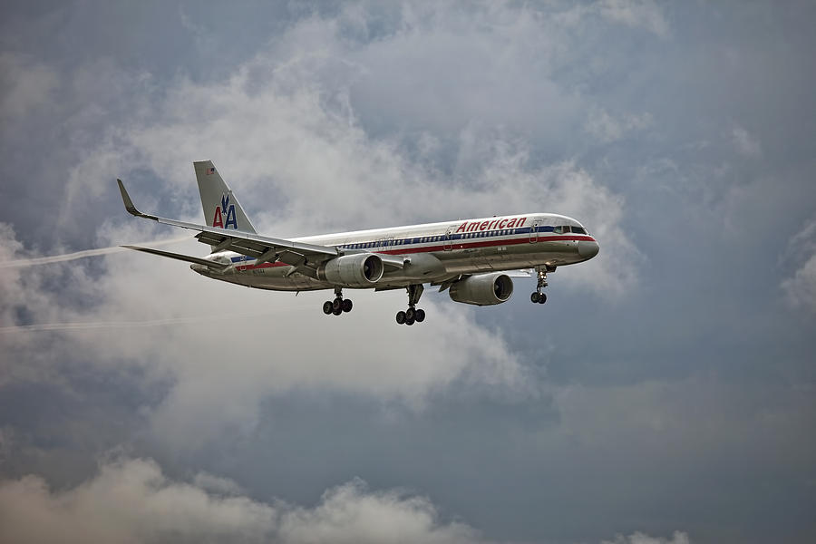American aircraft landing in the rain. Miami. FL. USA Photograph by Juan Carlos Ferro Duque