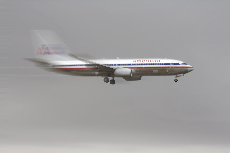 Airplane Photograph - American Airlines Boeing 7 Series Landing at DFW Airport by Douglas Barnard