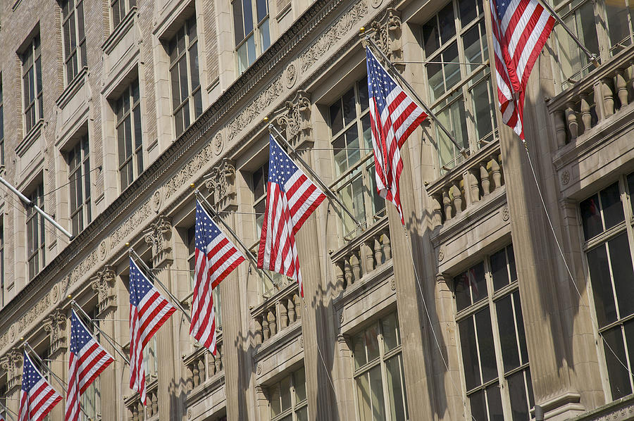 American Flags Hanging Outside Saks Fifth Avenue, New York Photograph by Barry Winiker