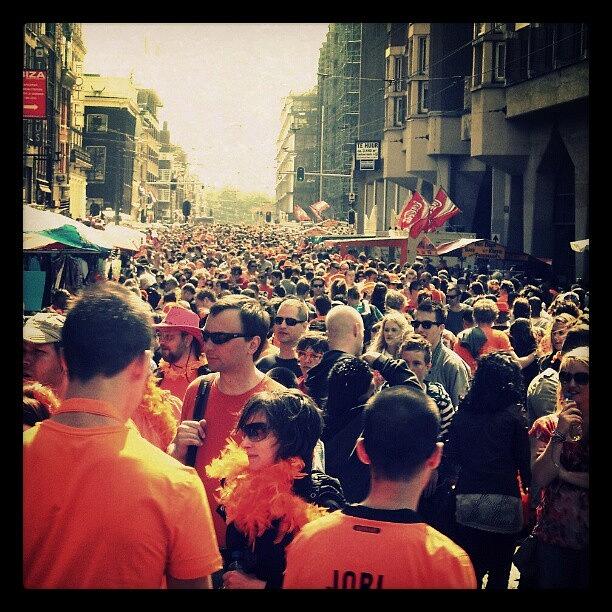 Holland Photograph - Amsterdam Is Rushing On Queens Day by Sigit Pamungkas