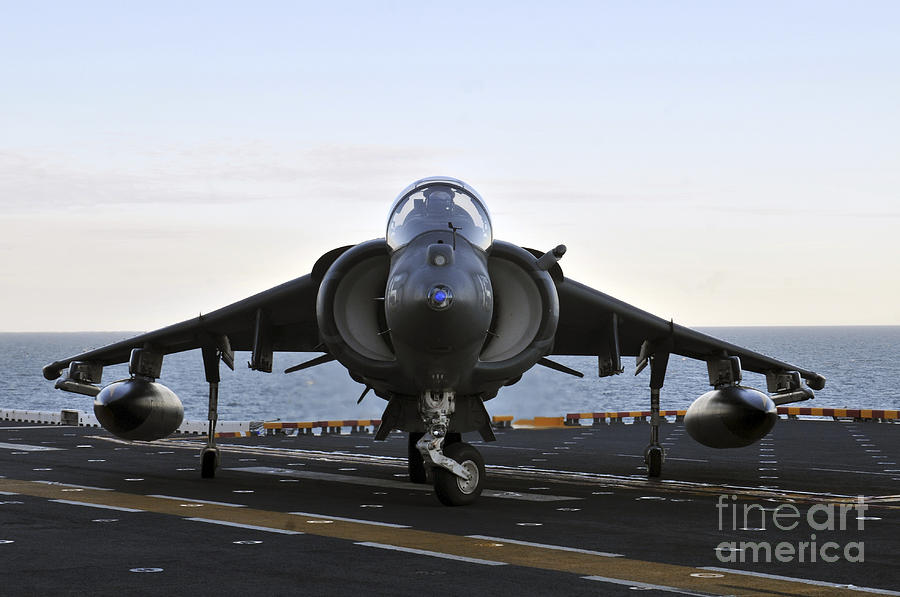 Transportation Photograph - An Av-8b Harrier Maneuvers by Stocktrek Images
