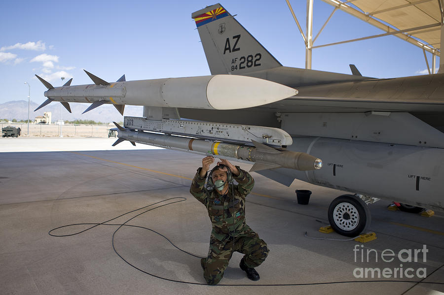An F-16 Crew Chief Conducts Preflight Photograph by HIGH-G Productions