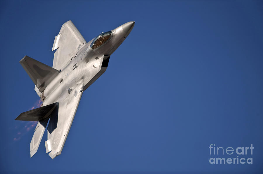 An F-22 Raptor Aircraft Performs Photograph by Stocktrek Images