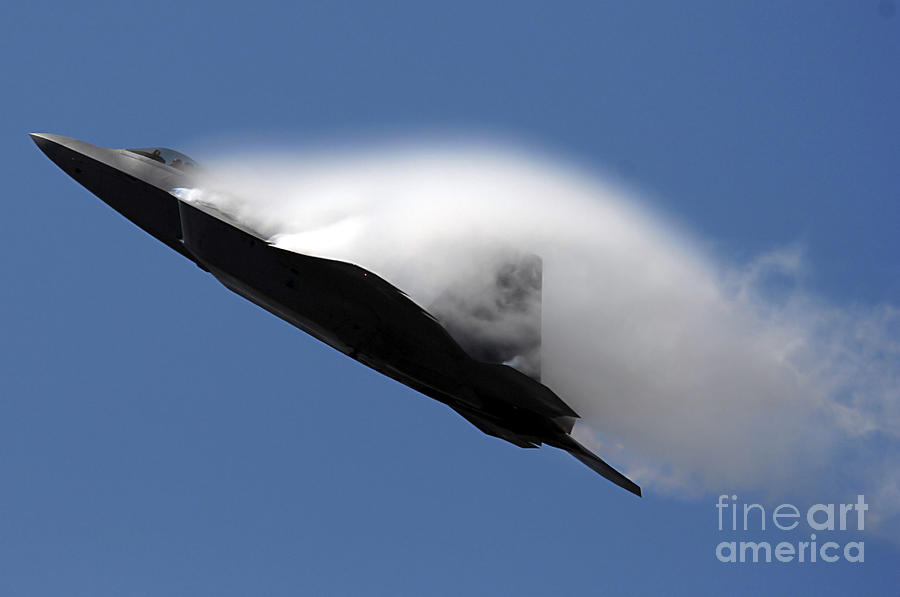 An F-22 Raptor Performs During An Air Photograph by Stocktrek Images
