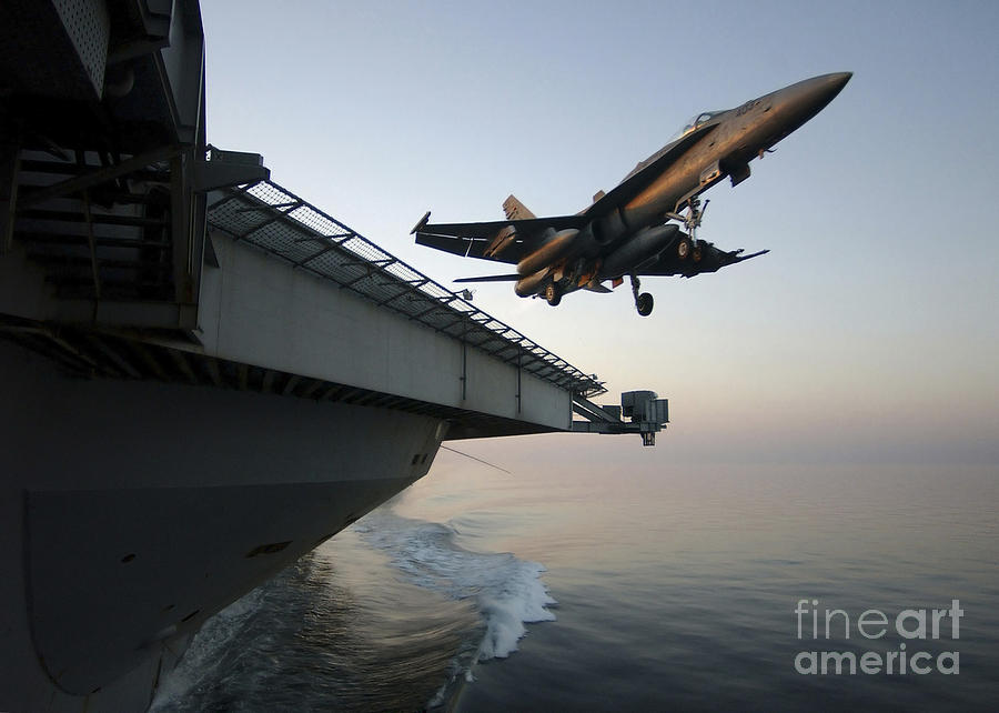 An Fa-18a Hornet Clears The Flight Deck Photograph