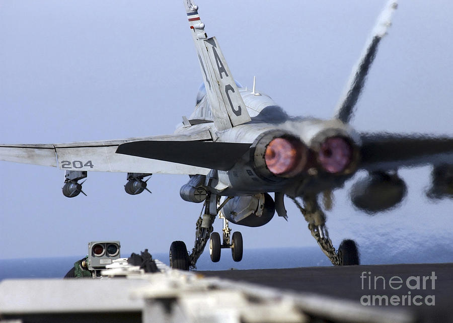 Airplane Photograph - An Fa-18a+ Hornet Launches by Stocktrek Images