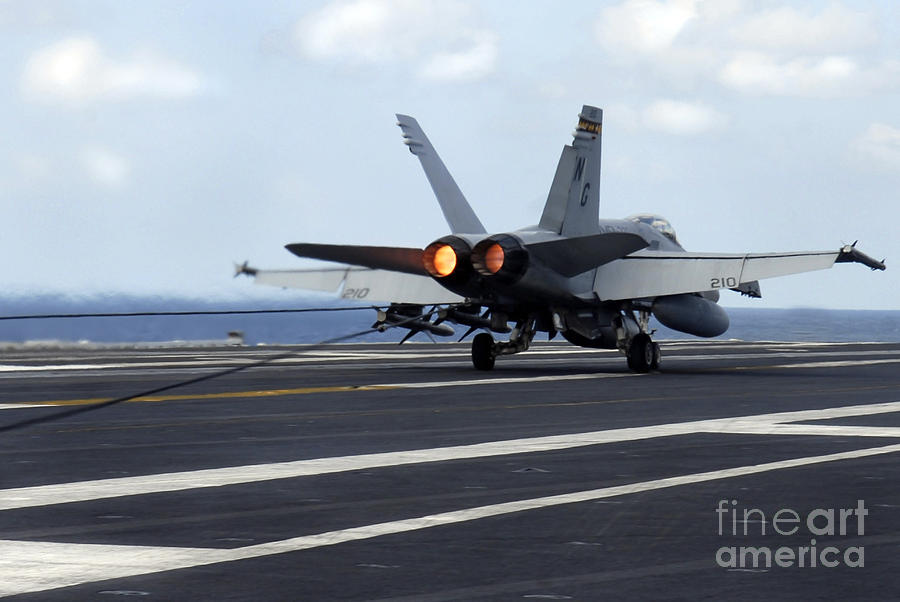 Airplane Photograph - An Fa-18c Hornet Successfully Lands by Stocktrek Images