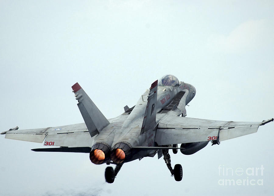 Airplane Photograph - An Fa-18c Hornet Taking Off by Stocktrek Images