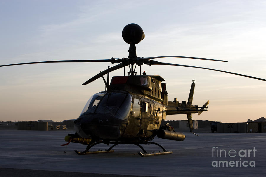 An Oh-58d Kiowa During Sunset Photograph by Terry Moore