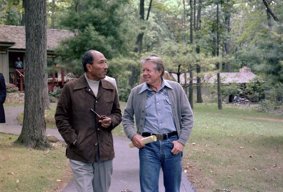 Anwar Sadat And Jimmy Carter Walking Photograph by Everett