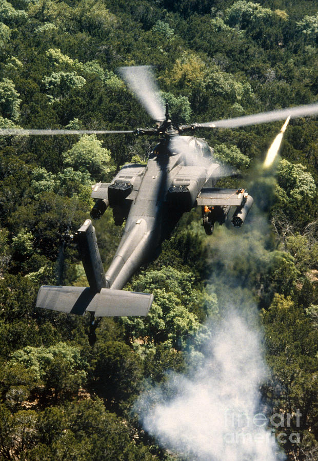 Apache Helicopter Firing Photograph by Stocktrek Images