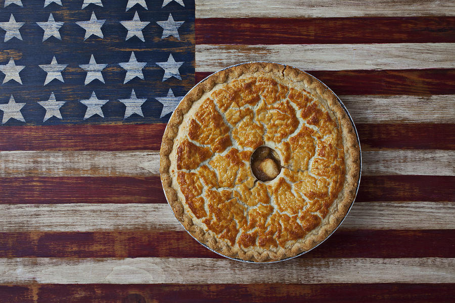Still Life Photograph - Apple pie on folk art  American flag by Garry Gay