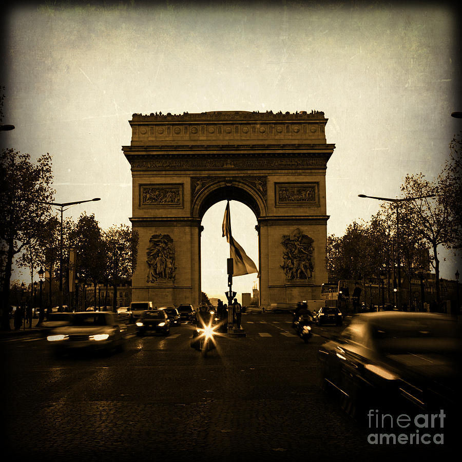 Arc De Triomphe In Paris France With Speeding Cars At Night Photograph