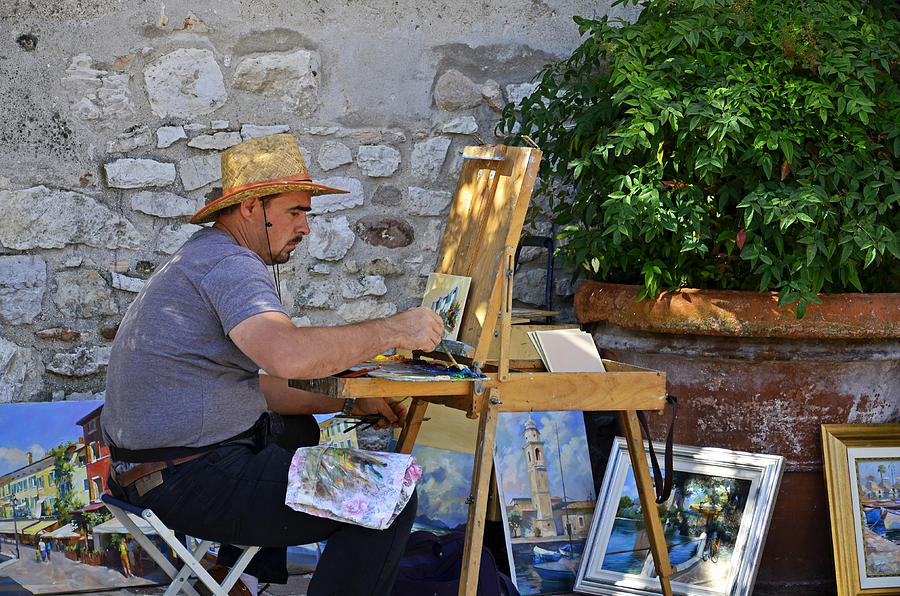 Artist in Lazise.Italy . Photograph by Martina Fagan