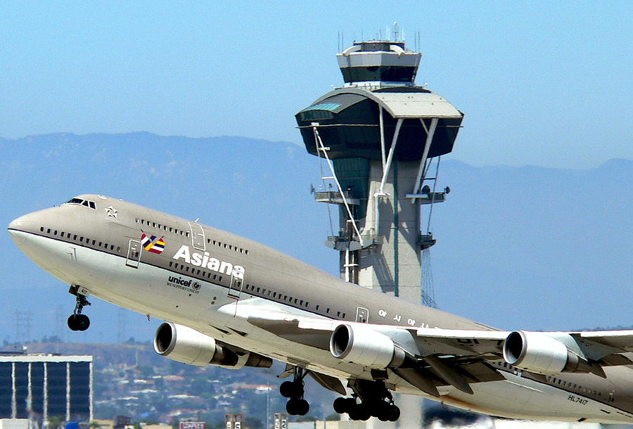 Asiana 747-400 and LAX Tower Photograph by Jeff Lowe