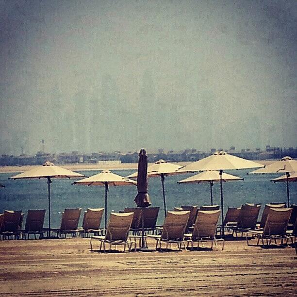 Atlantis Beach With Burg Khalifa -dubai Photograph by Mohammad Alhaddad