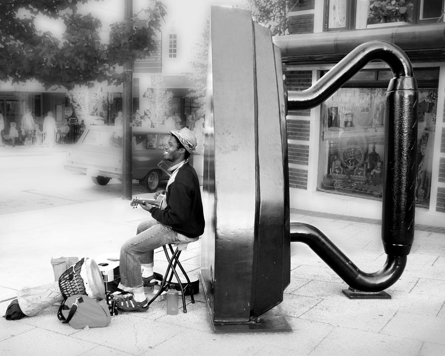 ATown Street Musician Photograph by Gray  Artus