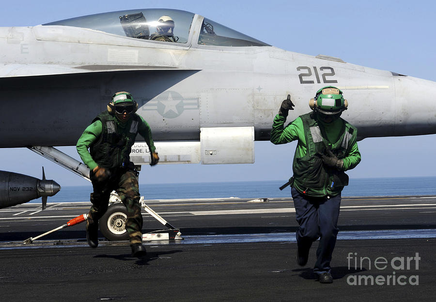 Aviation Boatswain Mates Signal A Clear Photograph by Stocktrek Images