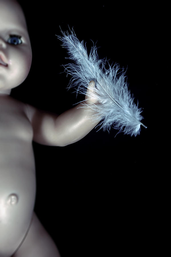 Still Life Photograph - Baby Doll With Feather by Joana Kruse