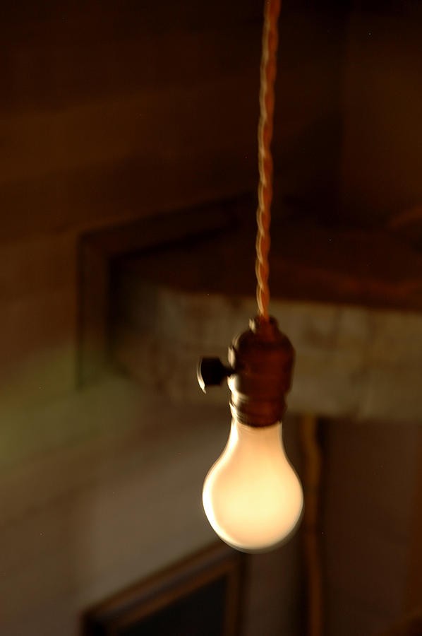 Bare Bulb Swinging Photograph