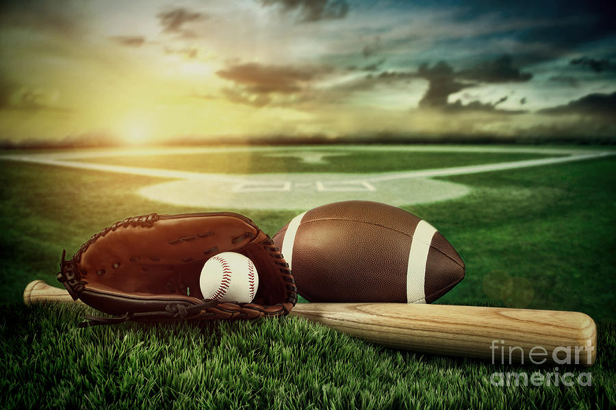 Baseball  bat  and mitt in field at sunset Photograph by Sandra Cunningham