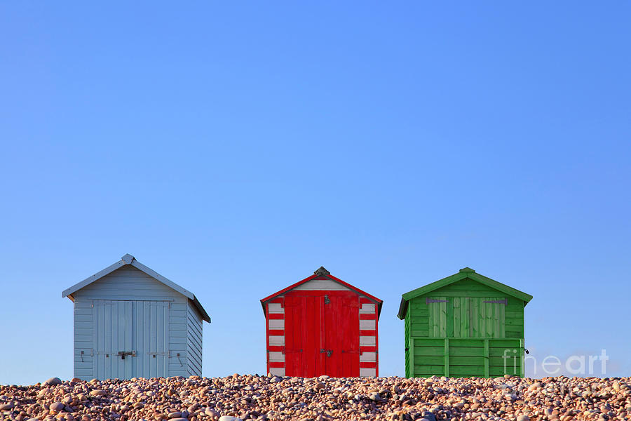 Summer Photograph - Beach huts and blue sky by Richard Thomas