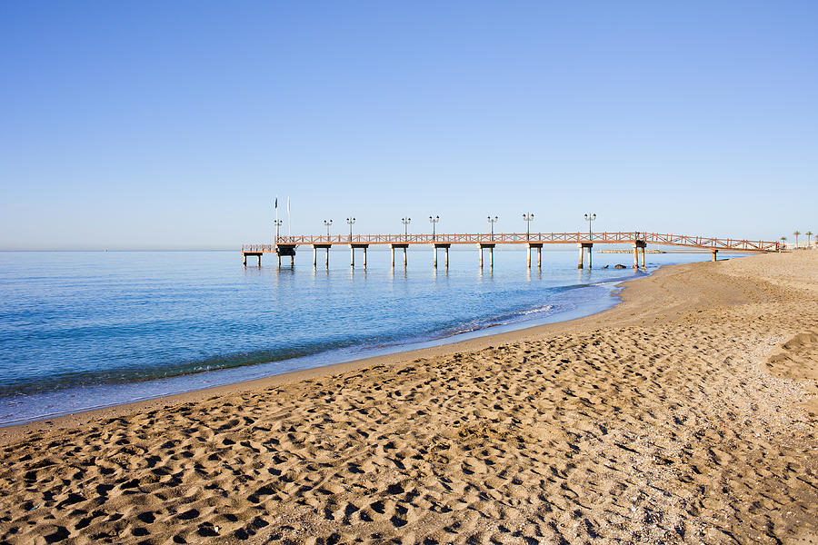 Beach Pier and Sea in Marbella Photograph by Artur Bogacki