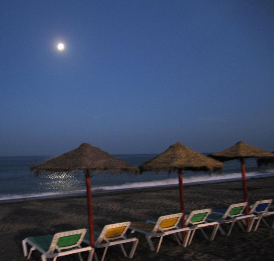Beach Umbrellas Under the Moon Costa Del Sol Spain Photograph by John Shiron