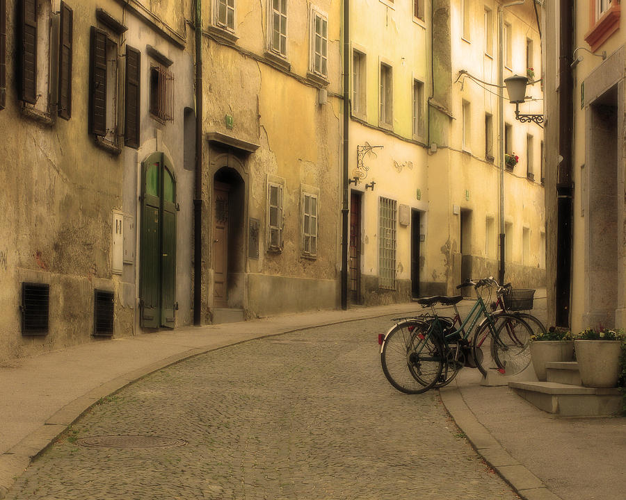 Bicycles On a Quiet Street in Ljubljana by Greg Matchick