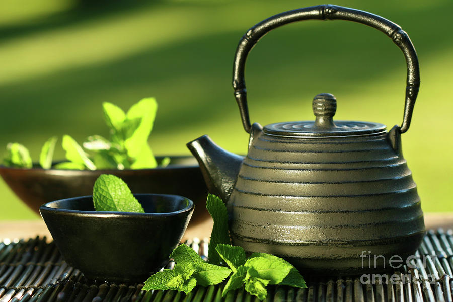 Tea Photograph - Black asian teapot with mint tea by Sandra Cunningham