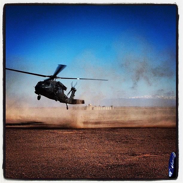 Helicopter Photograph - Black Hawk Landing in Afghanistan by Cody Barnhart